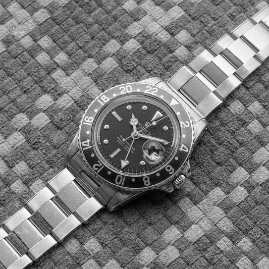 ROLEX GMT-MASTER REF. 1675 FIRST-SERIES LACQUERED BROWN NIPPLE DIAL 1971's